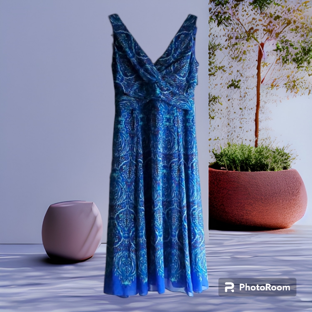Evan-Picon Sleeveless V-neck front and back. Zipper back. Free flow lined Dress